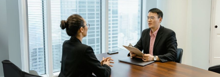 A fresh graduate interviewee answering job interview questions