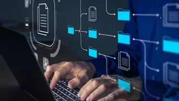 Person typing on a laptop with digital file icons overlay.