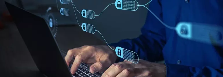 Person typing on a laptop with blockchain nodes shown as a digital overlay.