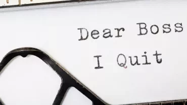 Typewriter with 'Dear Boss I Quit' typed on paper.