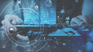 Futuristic digital interface with hands on a laptop, showcasing data and technology elements.