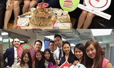 Group photo with colorful placards and a certificate, supporting a life-saving initiative indoors.